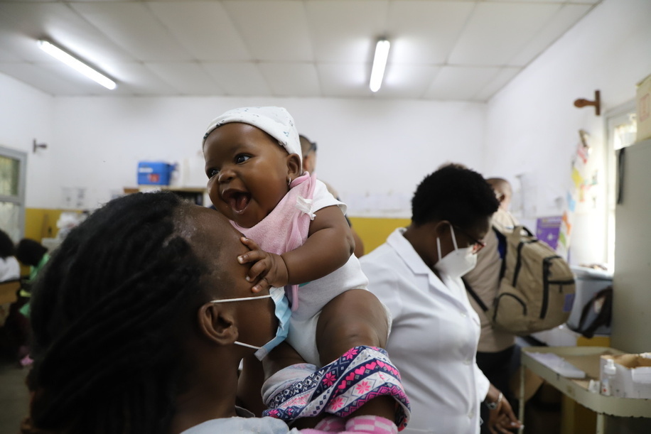 <p>A mother and infant wait to receive routing vaccines, including vaccines for COVID-19, at Matola II Health Centre in Maputo, Mozambique, on 29 April 2022.</p>