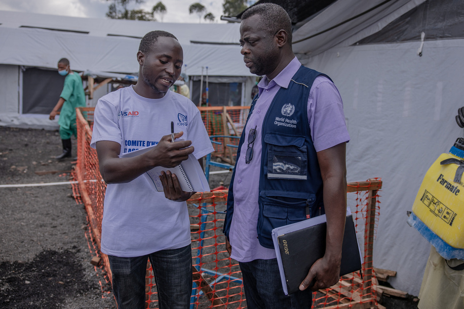 A WHO worker talks to a community outreach worker at the cholera treatment centre in the Rusayo camp for displaced persons, in the east of the Democratic Republic of Congo, on 9 November 2023.

Following the outbreak of war in the east of the Democratic Republic of Congo, many people were forced to flee their homes to find refuge. More than 2.4 million people have been displaced in the east of the country and more than 34,000 cases of cholera have been recorded in North Kivu since January this year. The WHO and its partners are helping to improve sanitation and provide emergency health services to camp residents, but the needs in the region are enormous and further assistance is required.