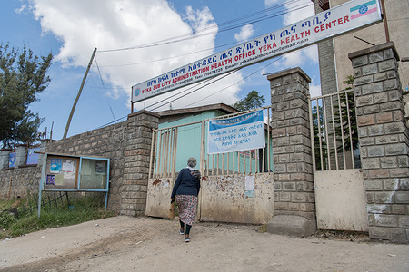 Wossene Shume, 55, enters the Yeka health center where she follows up her hypertension casein Addis Ababa, Ethiopia.